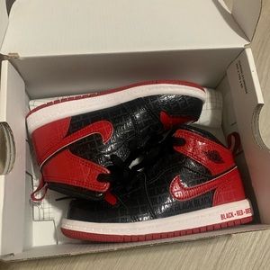 Black red and white Jordans